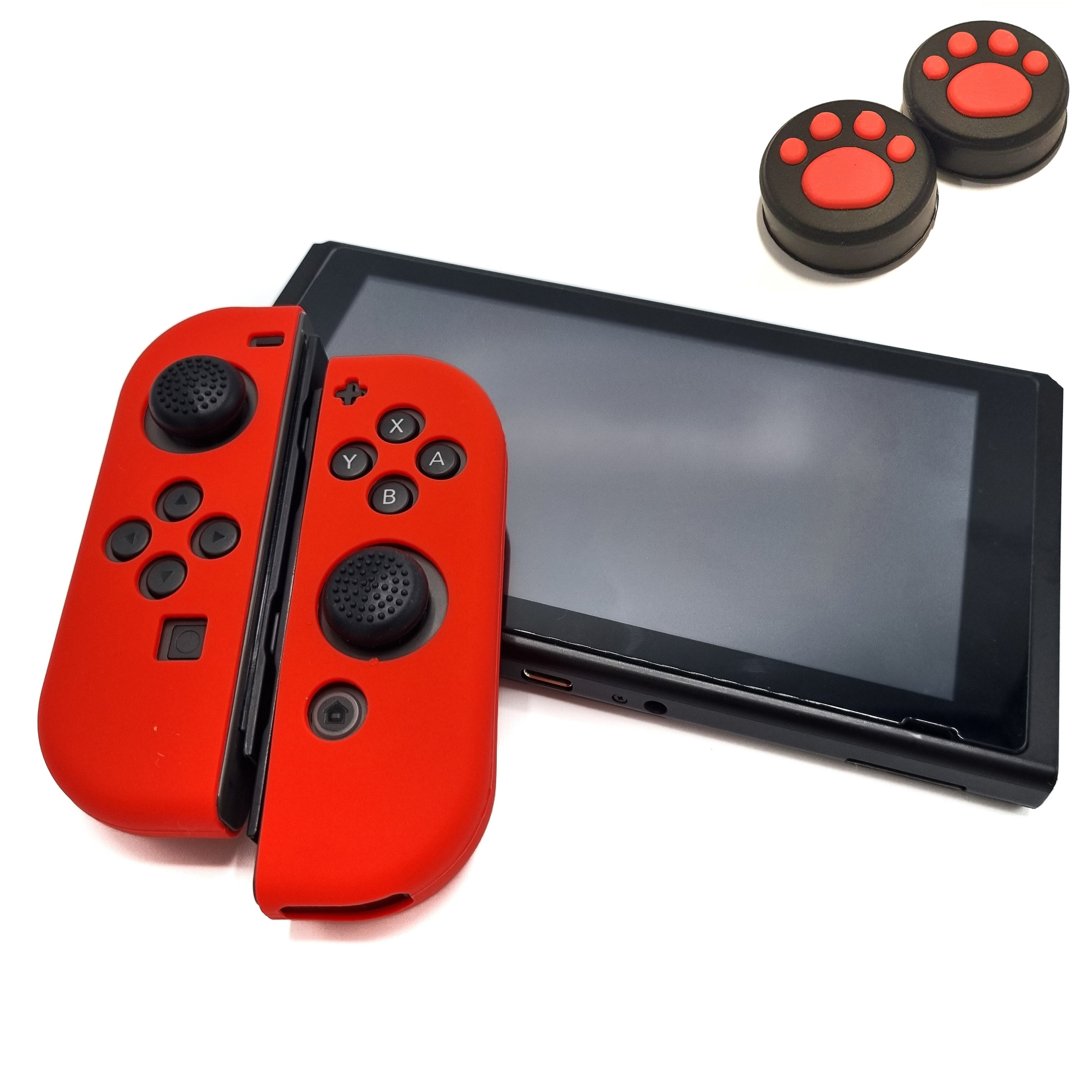 Schutzhüllen + Daumengriffe | Performance Anti-Rutsch-Haut | Softcover-Griffhülle | Rot + Beine Schwarz mit Rot | Zubehör passend für Nintendo Switch Joy-Con Controller